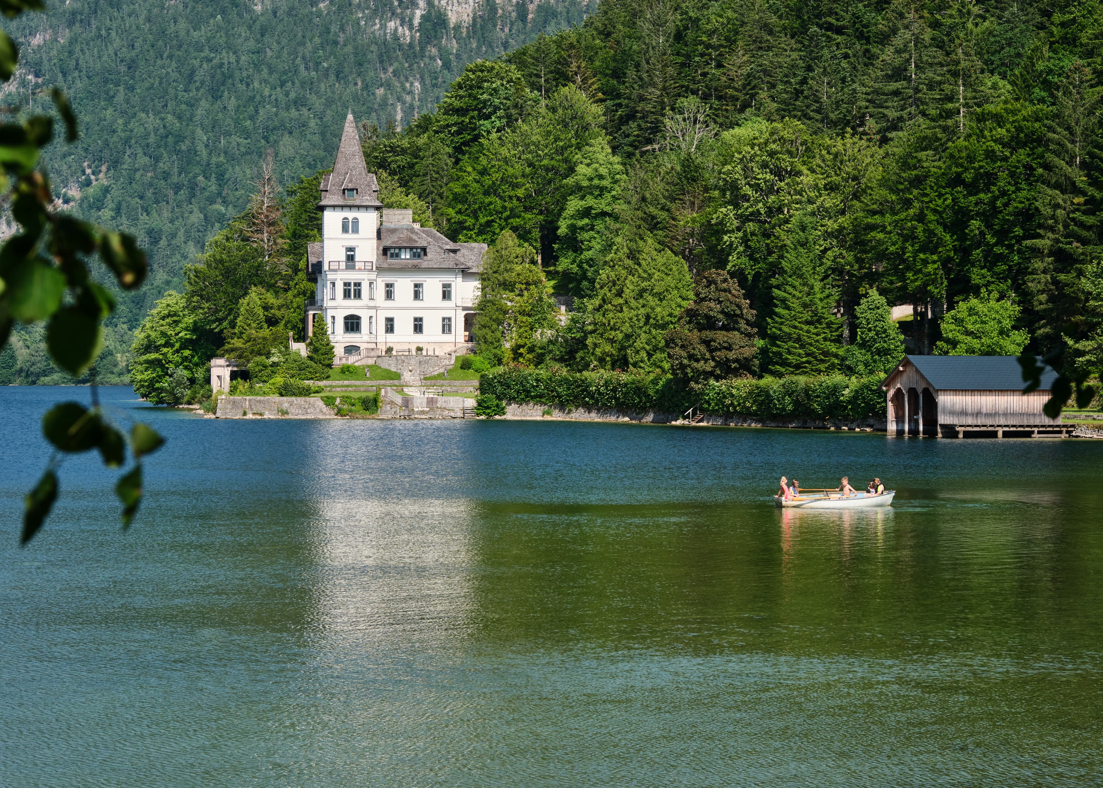 Rowboat on glassy alpine lake near Hallstatt