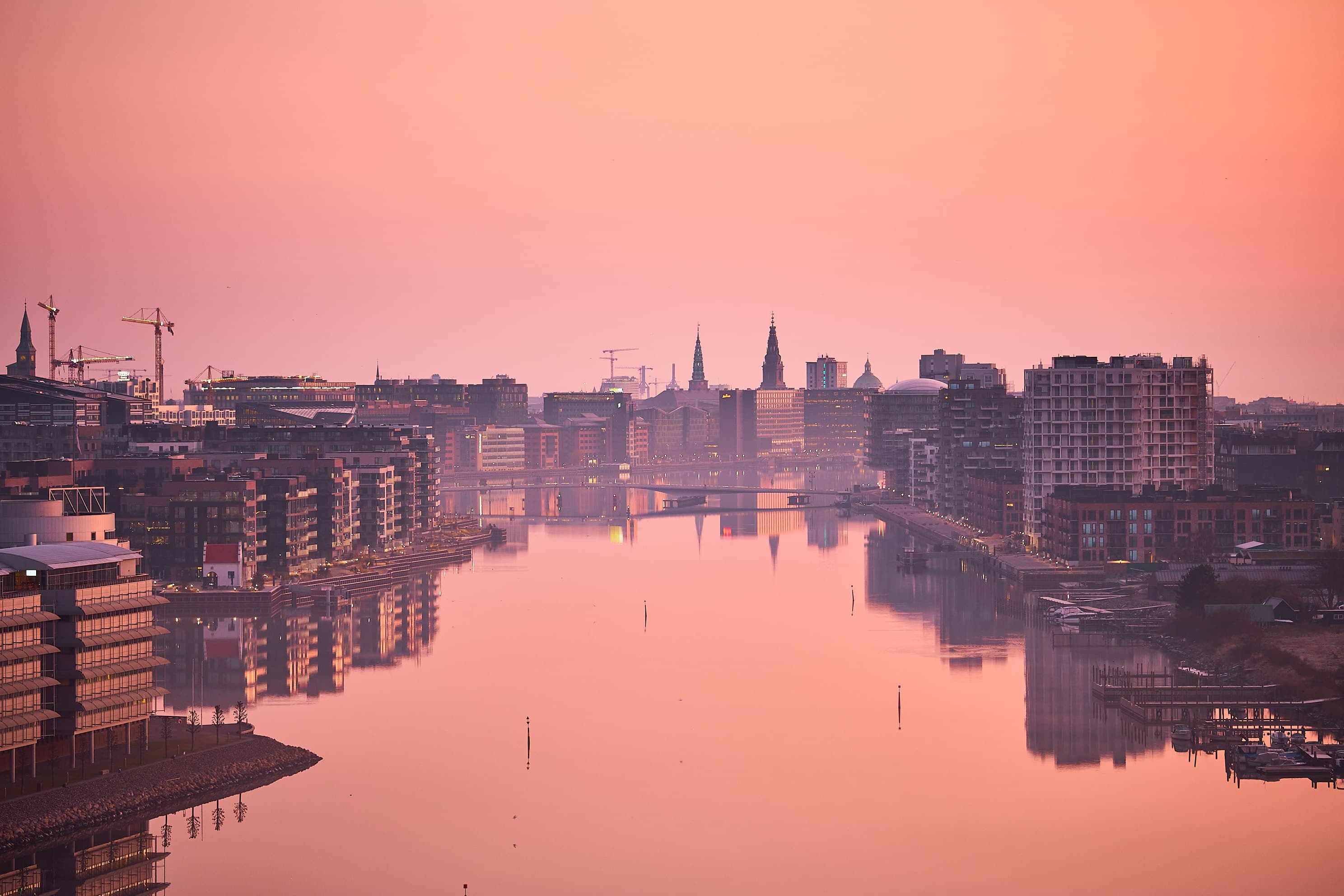 Copenhagen harbour at pink dawn, perfect reflection