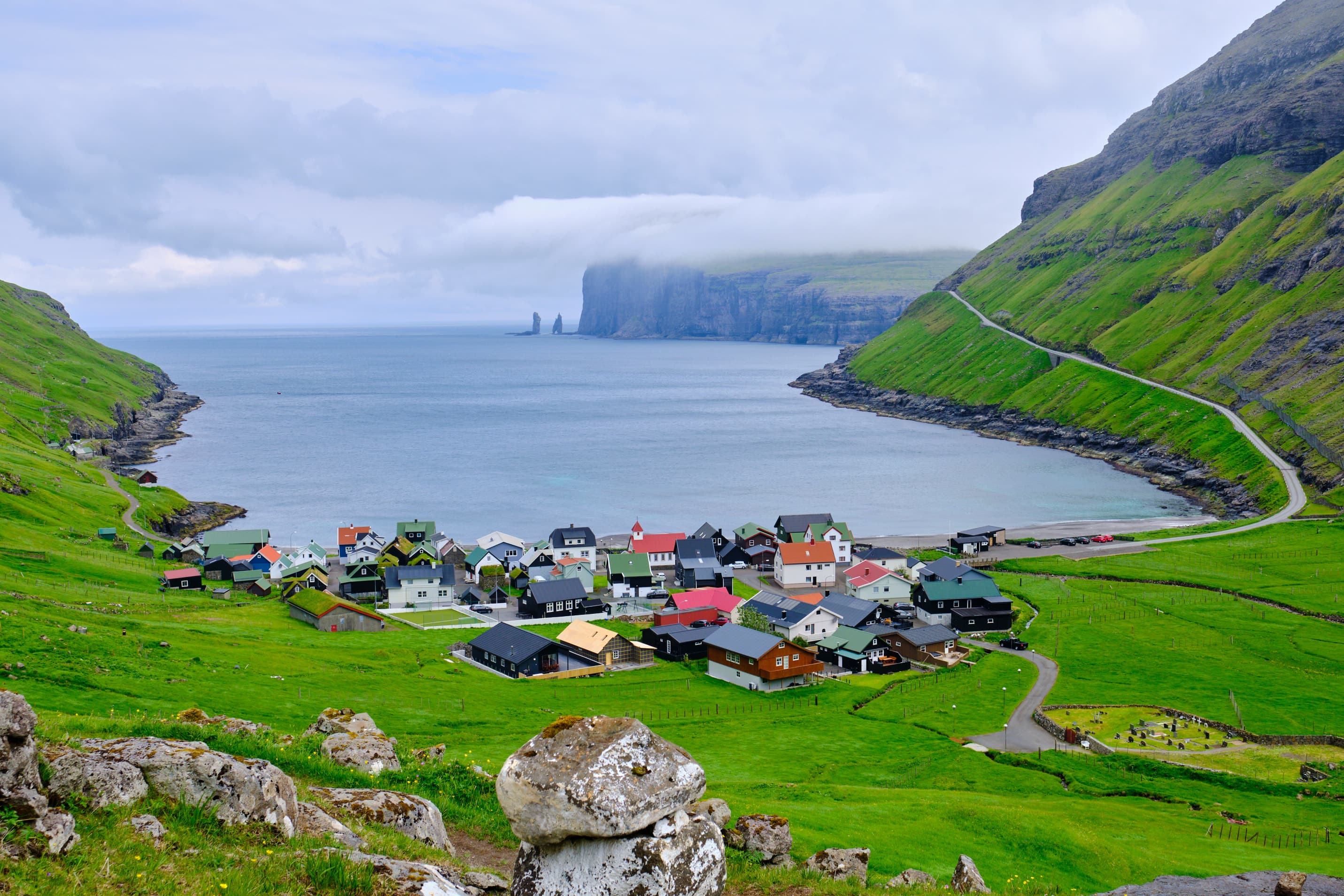 Tjørnuvík village panorama with iconic rock stacks